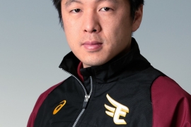 Portrait of a young man in athletic jacket.